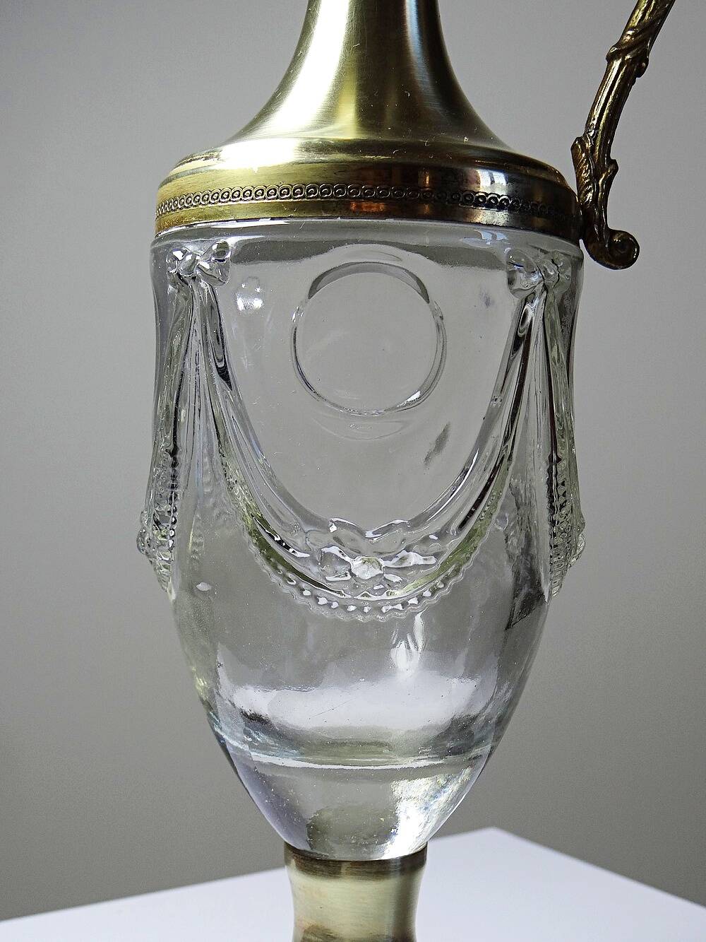 Vintage decorative jug in moulded glass and gilded brass, Italy circa 1980.