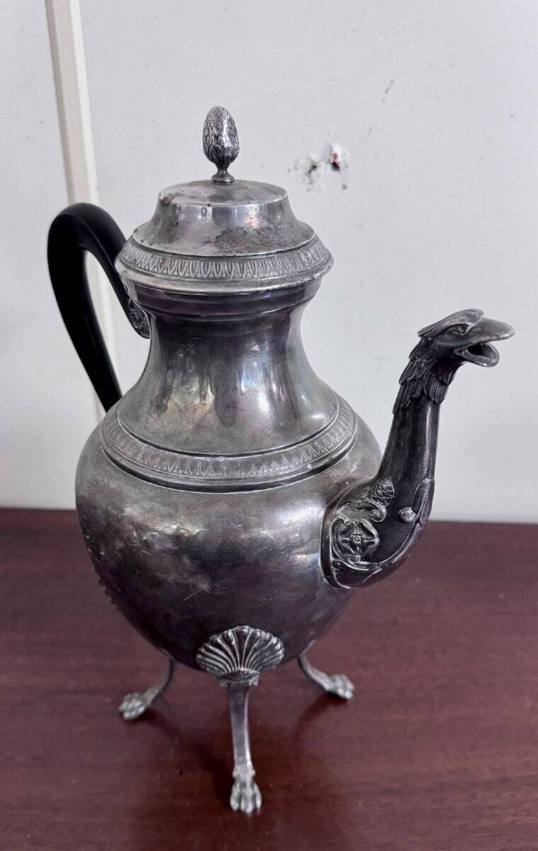 Empire style silver-plated verseuse, resting on three sculpted feet.