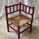 Red turned wood corner chair with rush seating