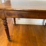 Walnut bistro table, feet turned.
