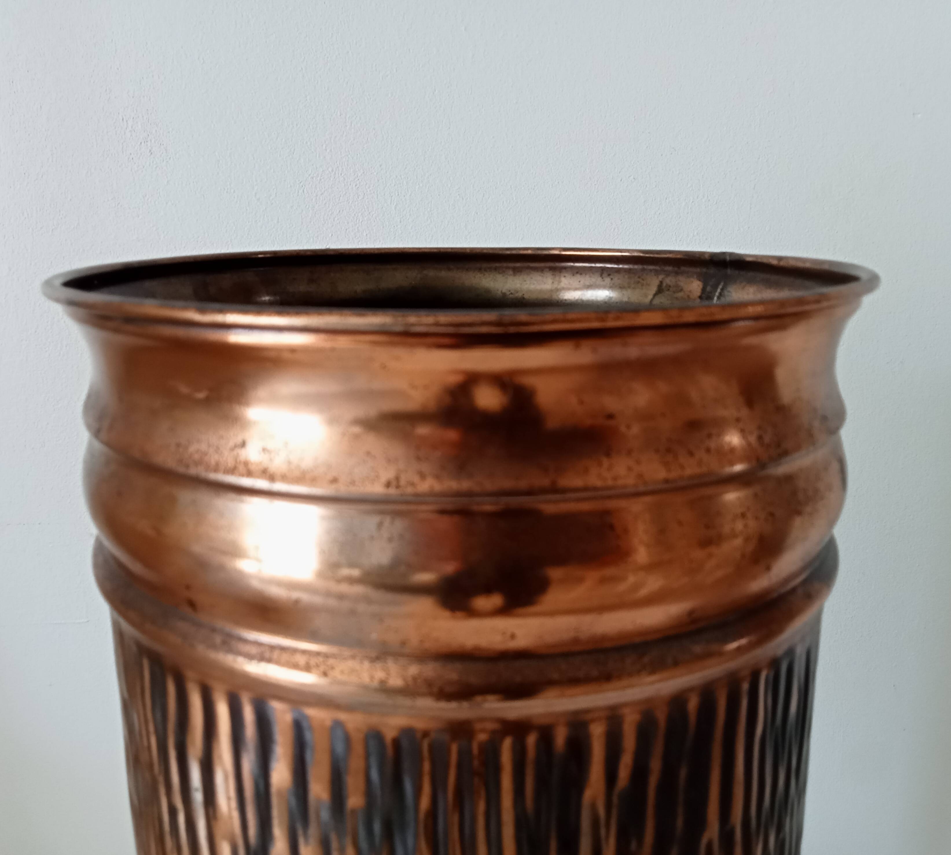 Vintage brutalist umbrella stand in hammered copper with a wood effect.