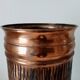 Vintage brutalist umbrella stand in hammered copper with a wood effect.