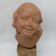 Bust young smiling girl. Circa 1900. Art Deco. Signed.