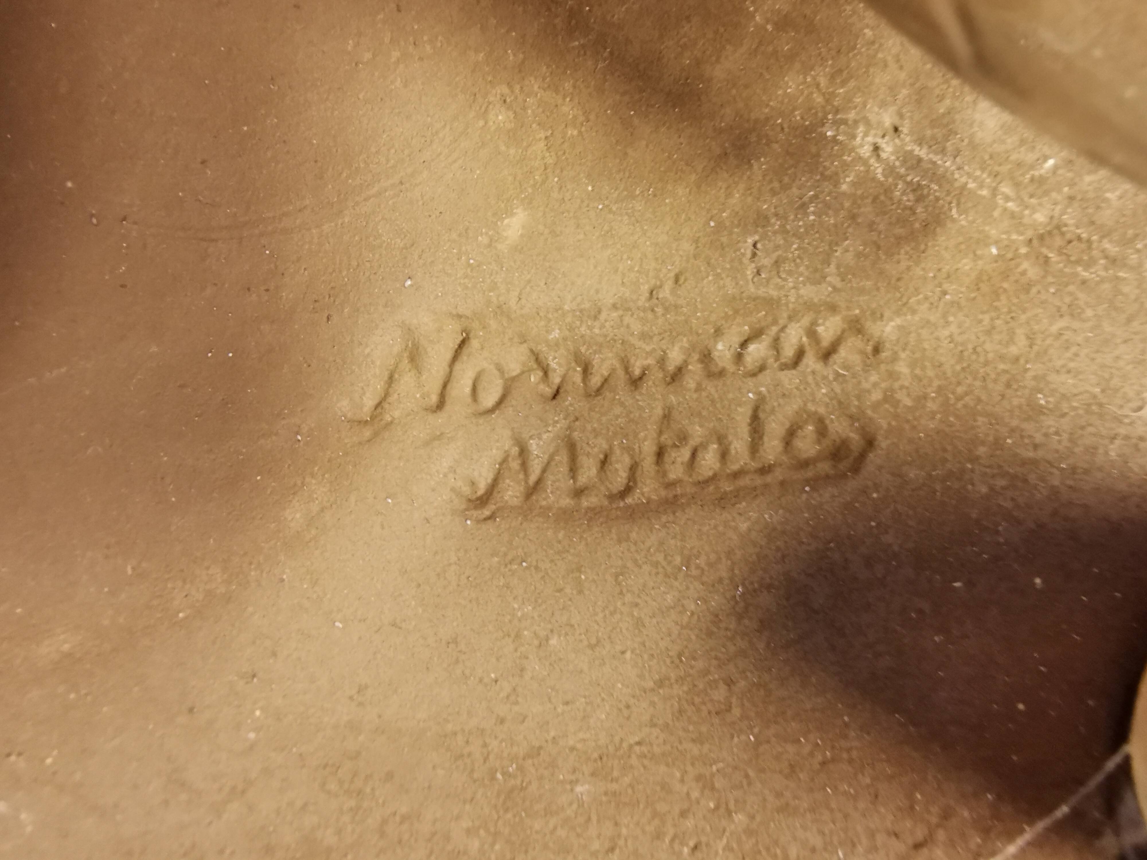 Wall light made from brown and red ceramic. Signed Norman Motala Sweden 1970s.