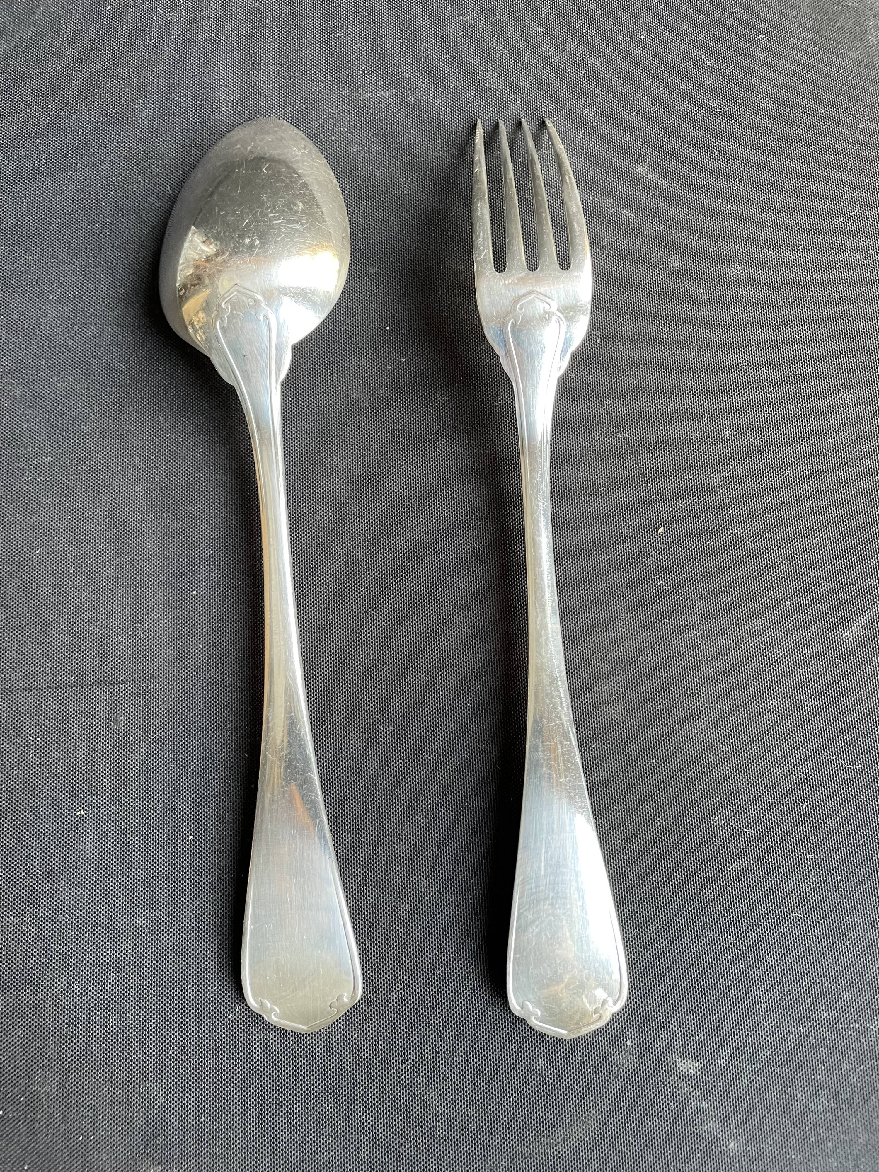 12 Christofle table forks and 12 spoons