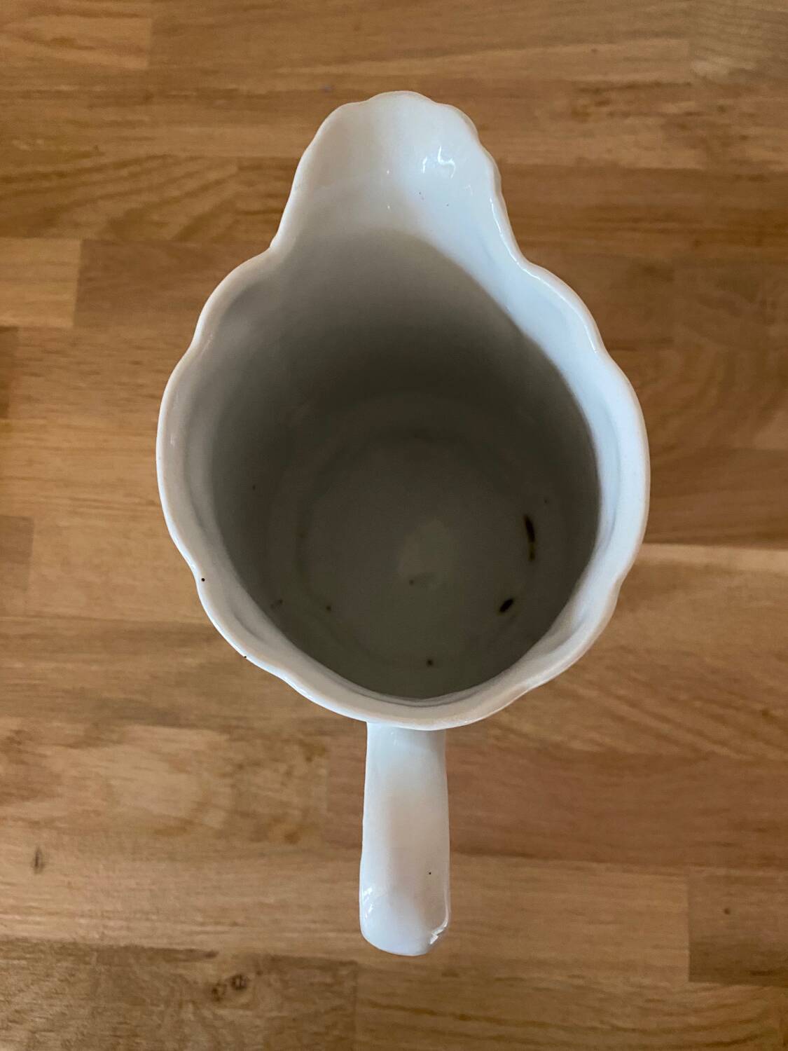 Old ceramic pitcher decorated with flowers