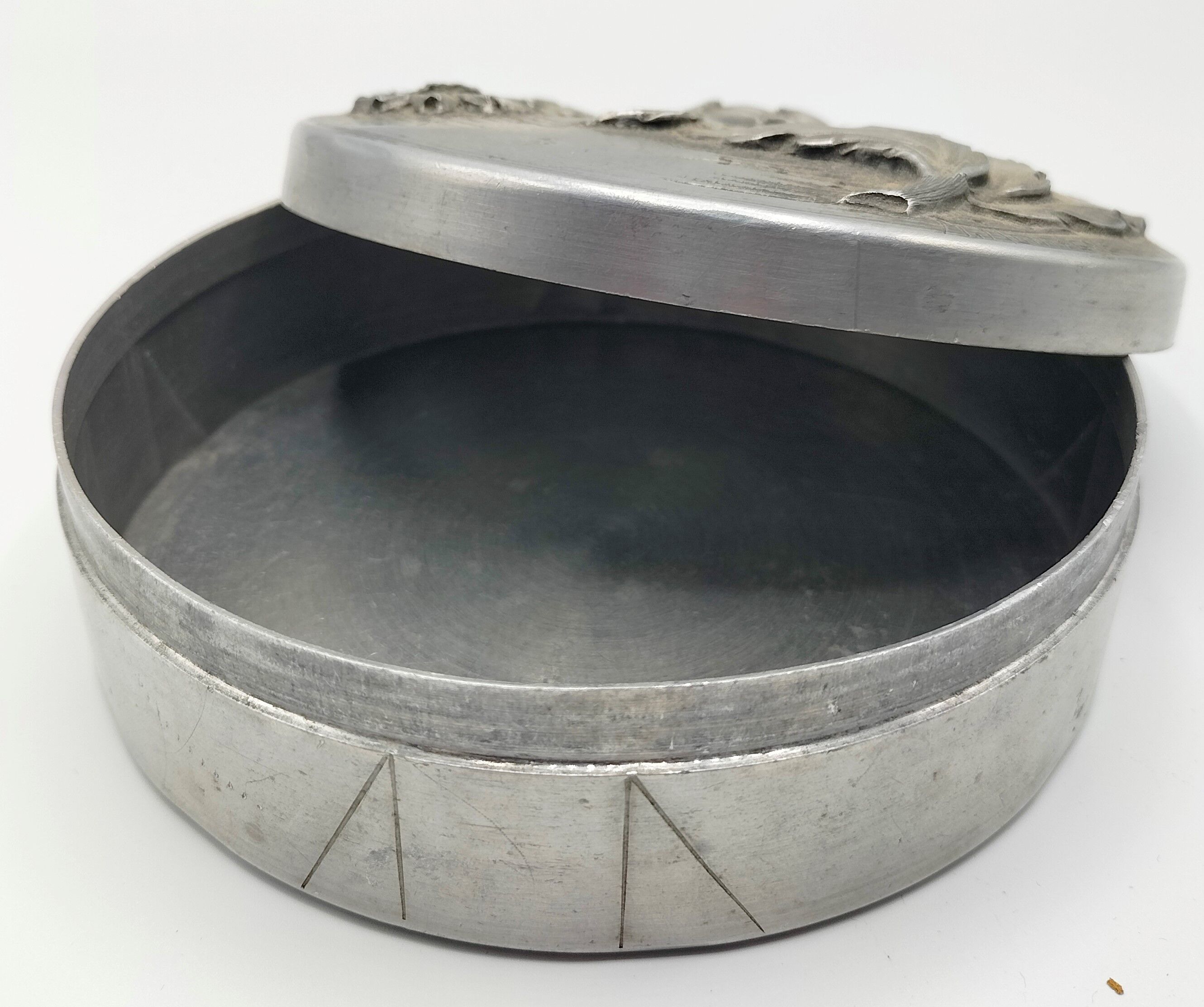 Metal candy box pushed back