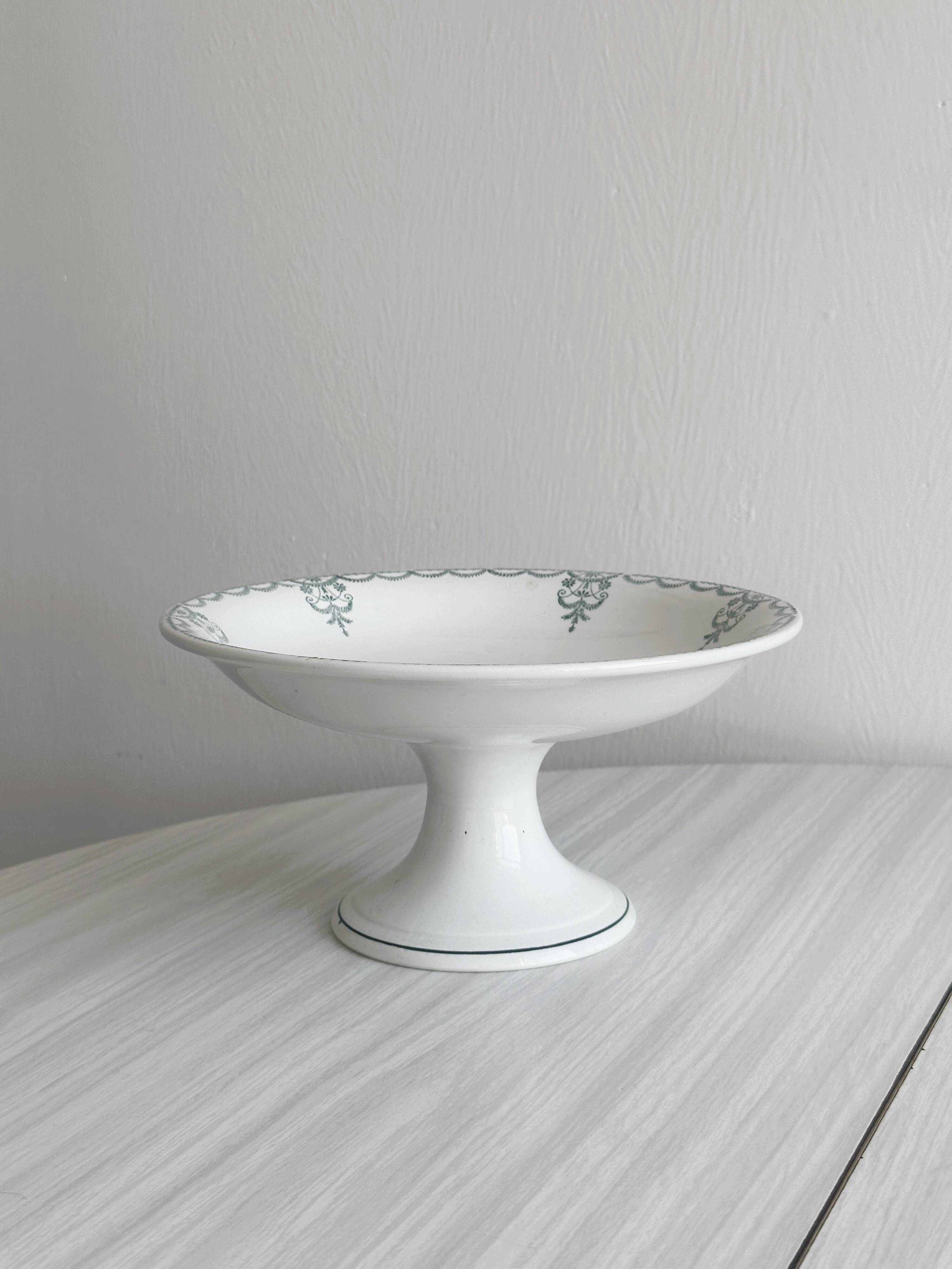 Earthenware fruit bowl on foot