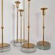 Gunnar Ander, four candlesticks, brass and glass, Ystad Metall, Swedish modern.