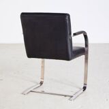 Steel armchair with leather upholstery