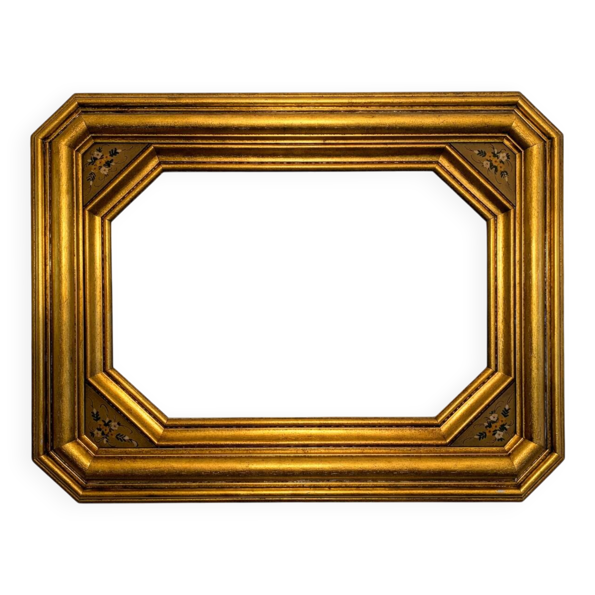 Antique octagonal mirror in gilded wood with painted floral decoration.