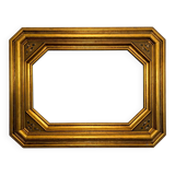 Antique octagonal mirror in gilded wood with painted floral decoration.