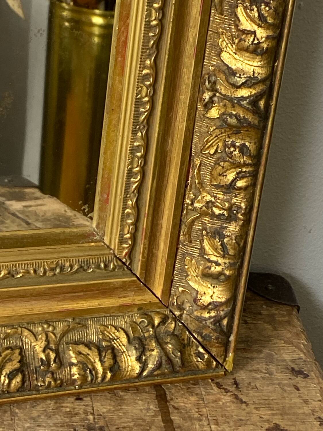 Antique mirror in carved gilded wood