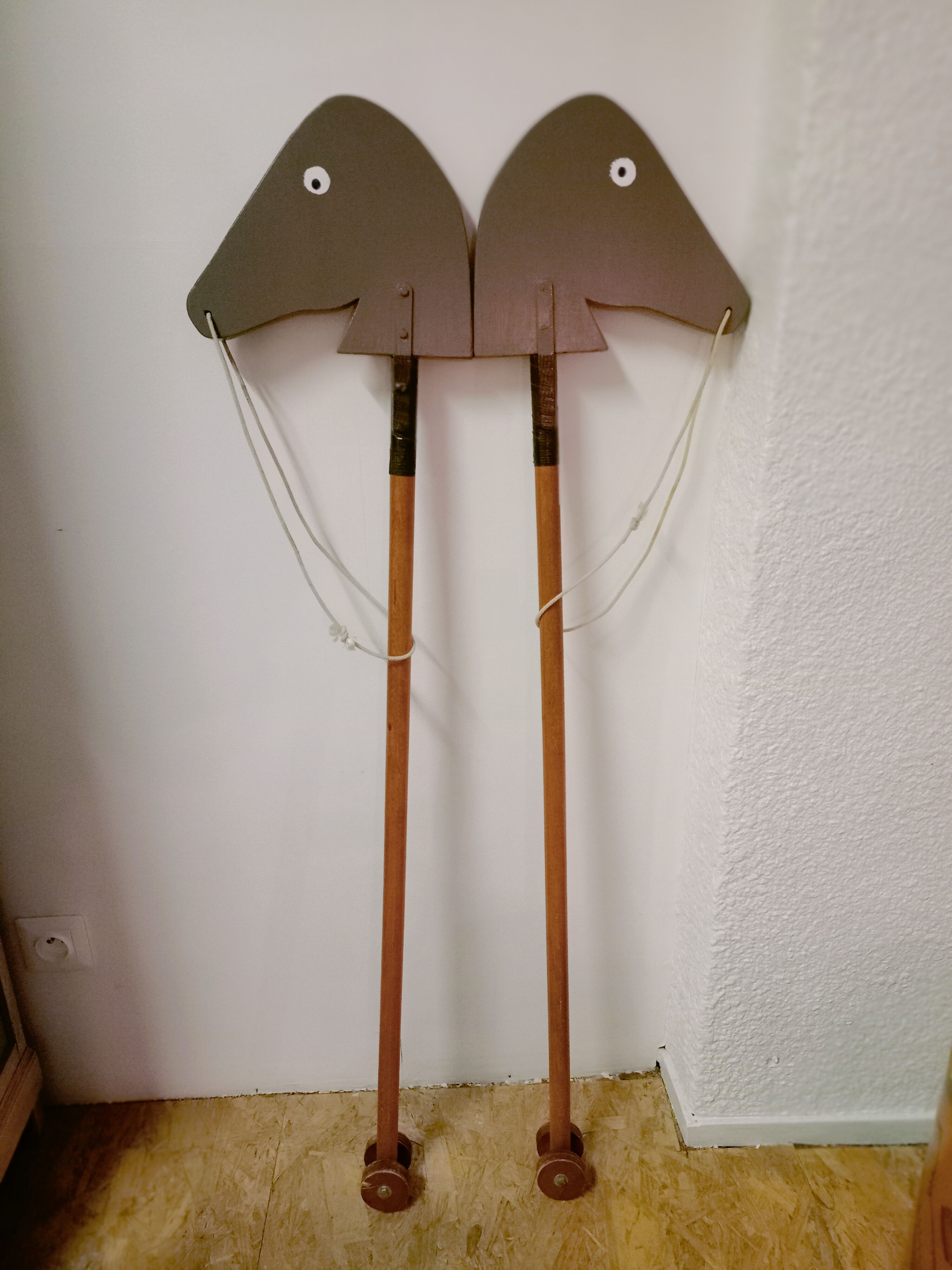 Wooden horses stick on wheels