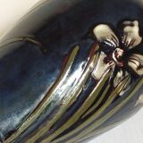 Old enameled earthenware vase with daffodils early 20th century