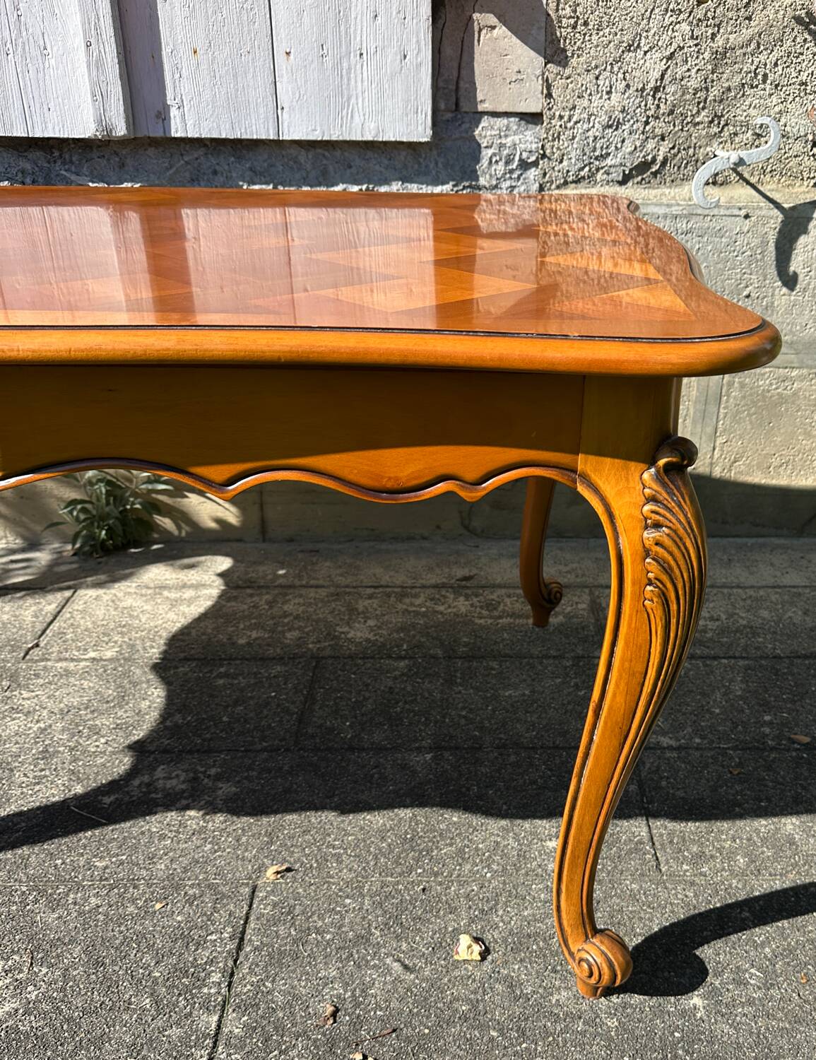 Antique extendable table in cherry wood and marquetry in the Louis XV style.