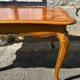 Antique extendable table in cherry wood and marquetry in the Louis XV style.