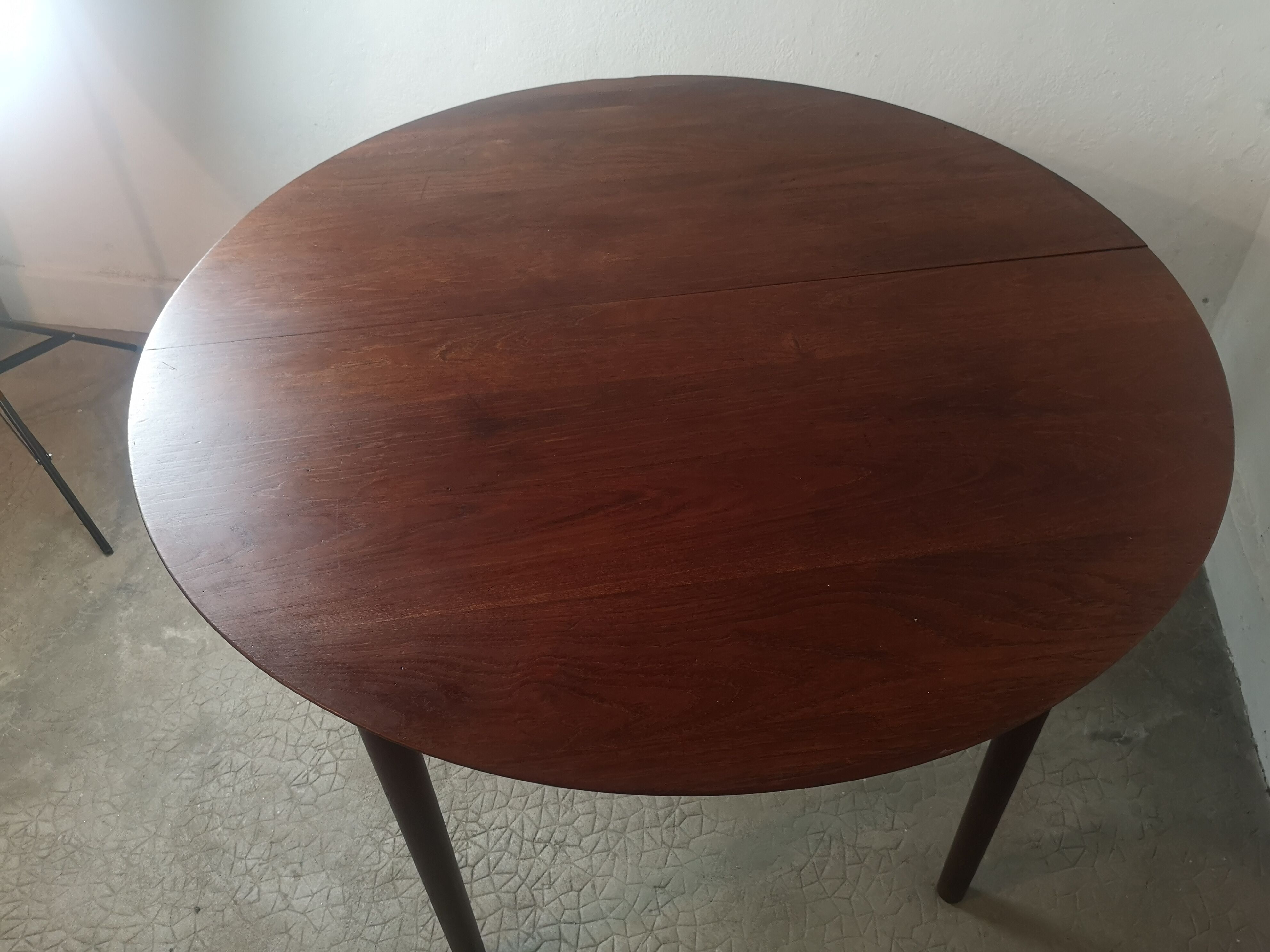 Scandinavian extendable round dining table in teak