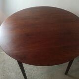 Scandinavian extendable round dining table in teak