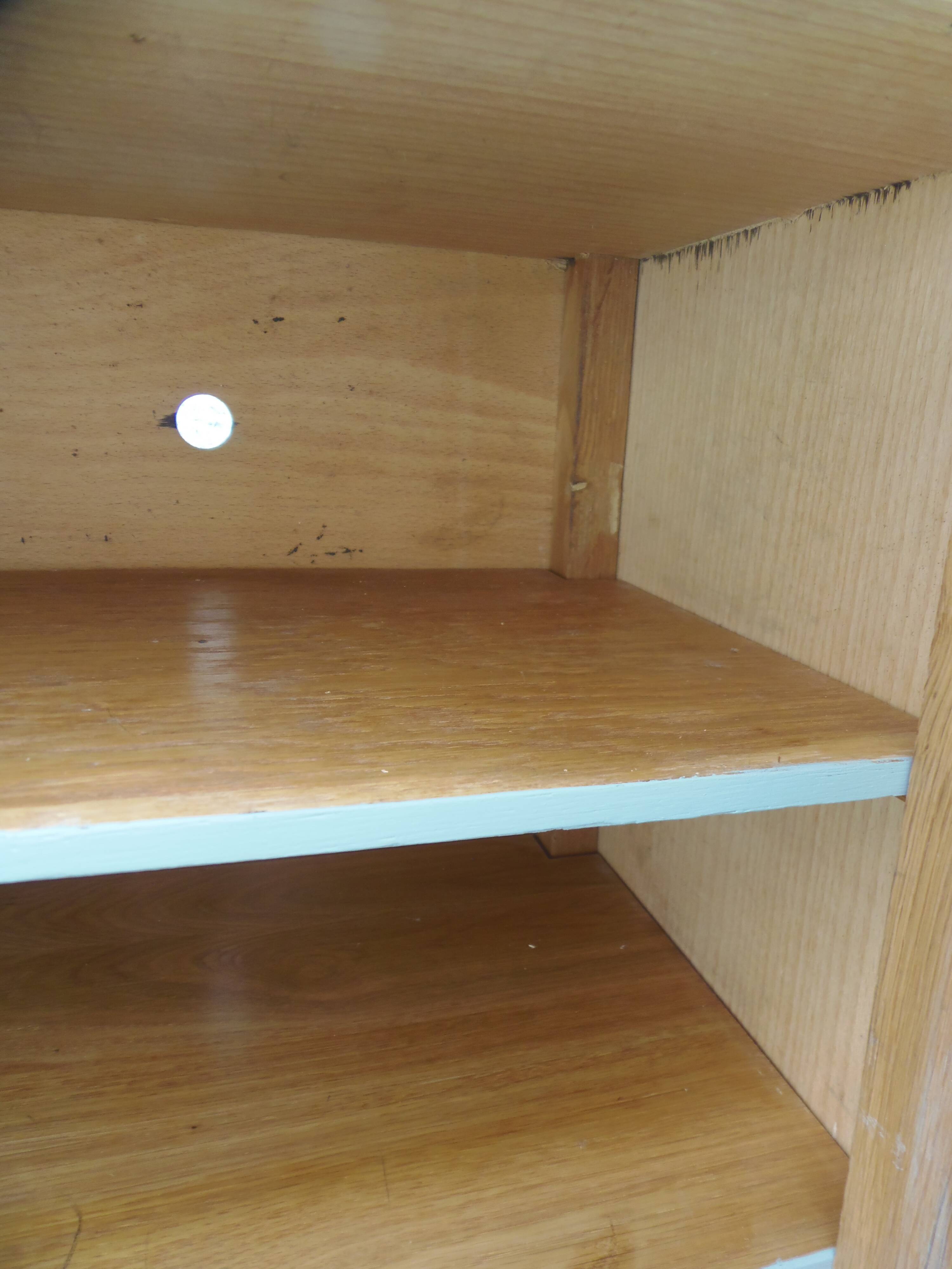 Small vintage piece of furniture with a shallow depth, re-enchanted in grey-green.