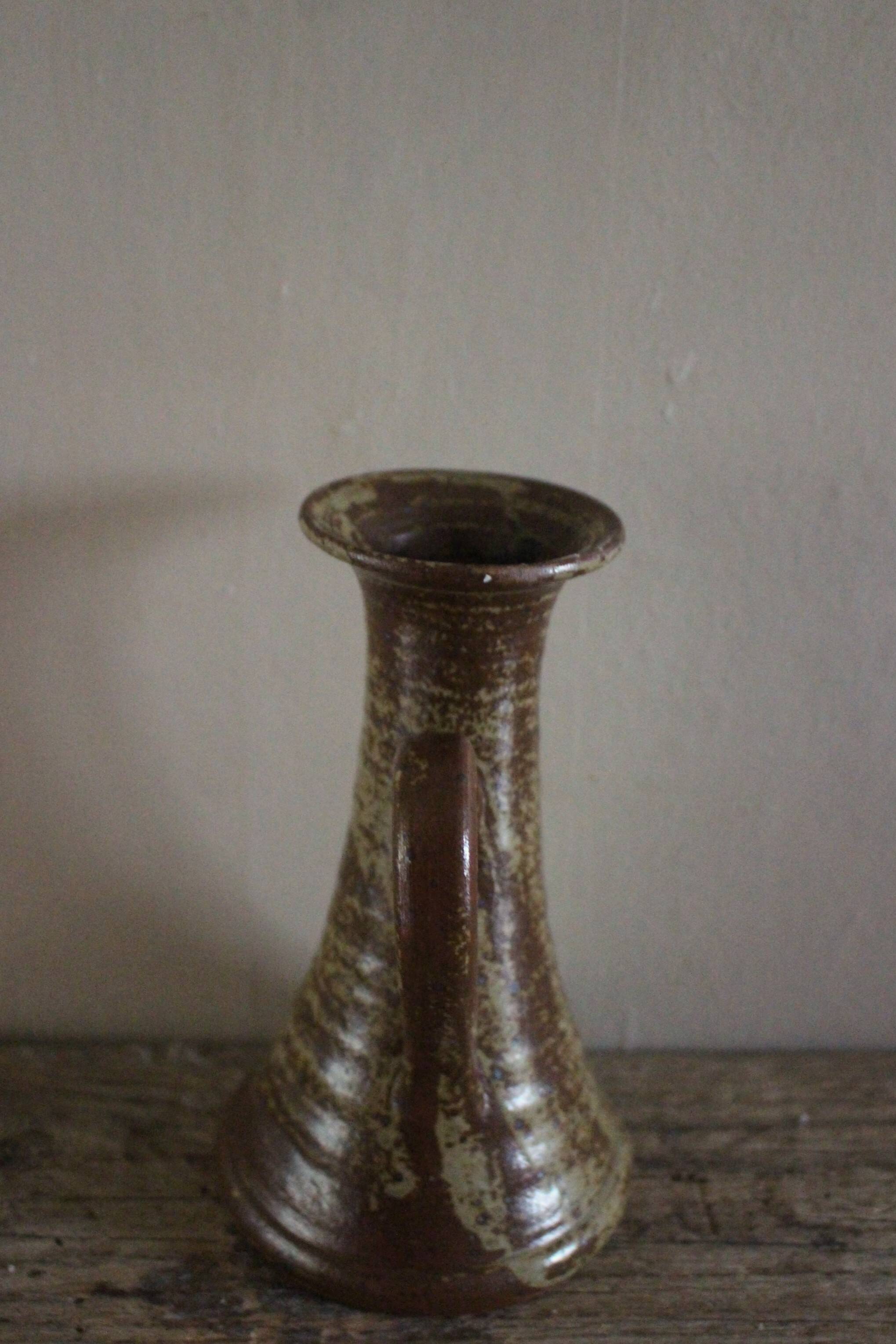 Vintage pyrite-glazed stoneware candlestick with handle