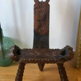 Old tripod milking chair