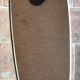 Vintage 1960 free-form mirror known as a retro mirror with a gold and black metal trim.