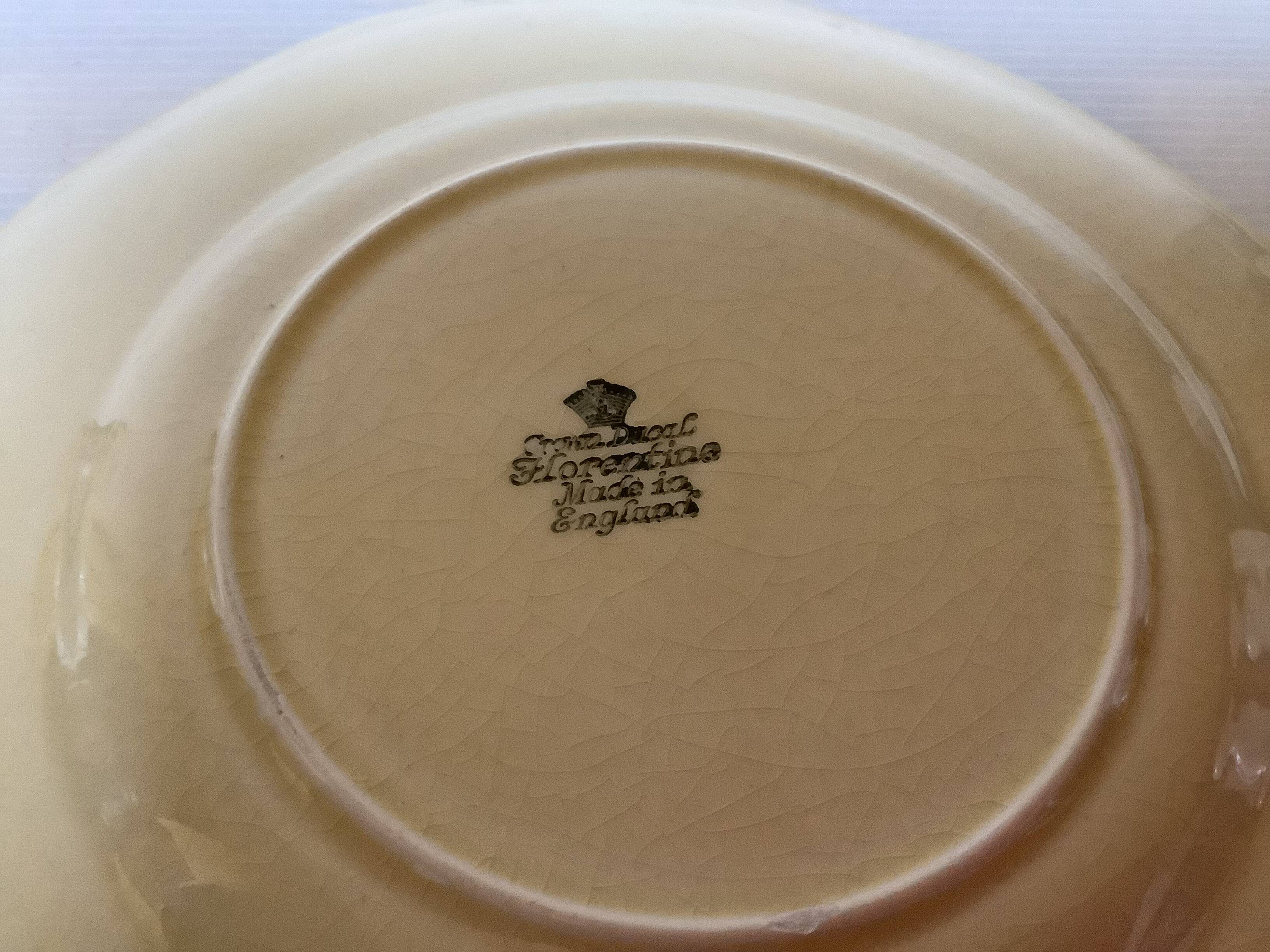 Five small floral plates England