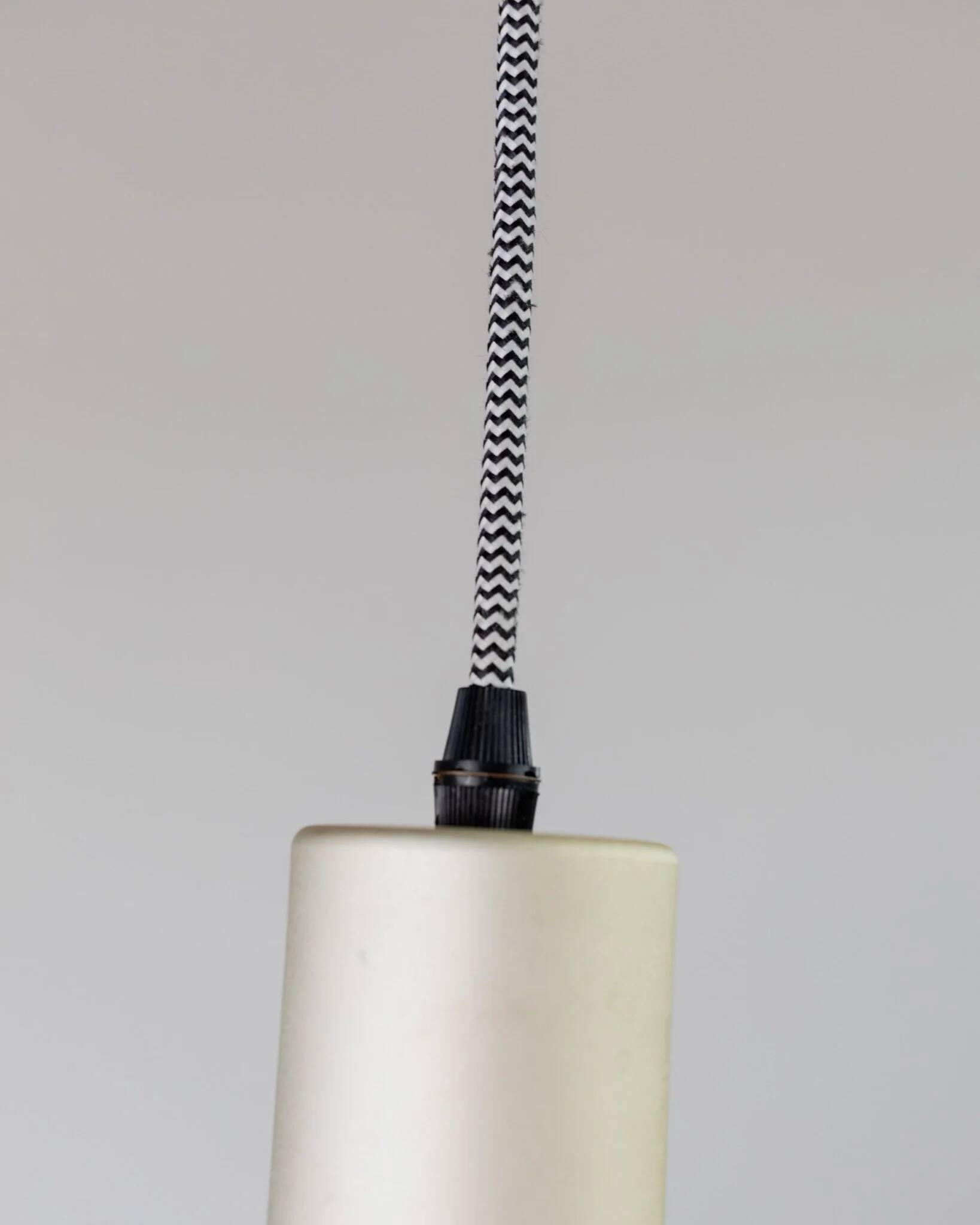 Vintage metal ceiling suspension – postmodern Memphis style from the 1980s, purple, green, silver, striped cable, Pop Art interior, retro light fixture.