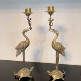 Pair of chiseled and gilded bronze candlesticks depicting perched waders