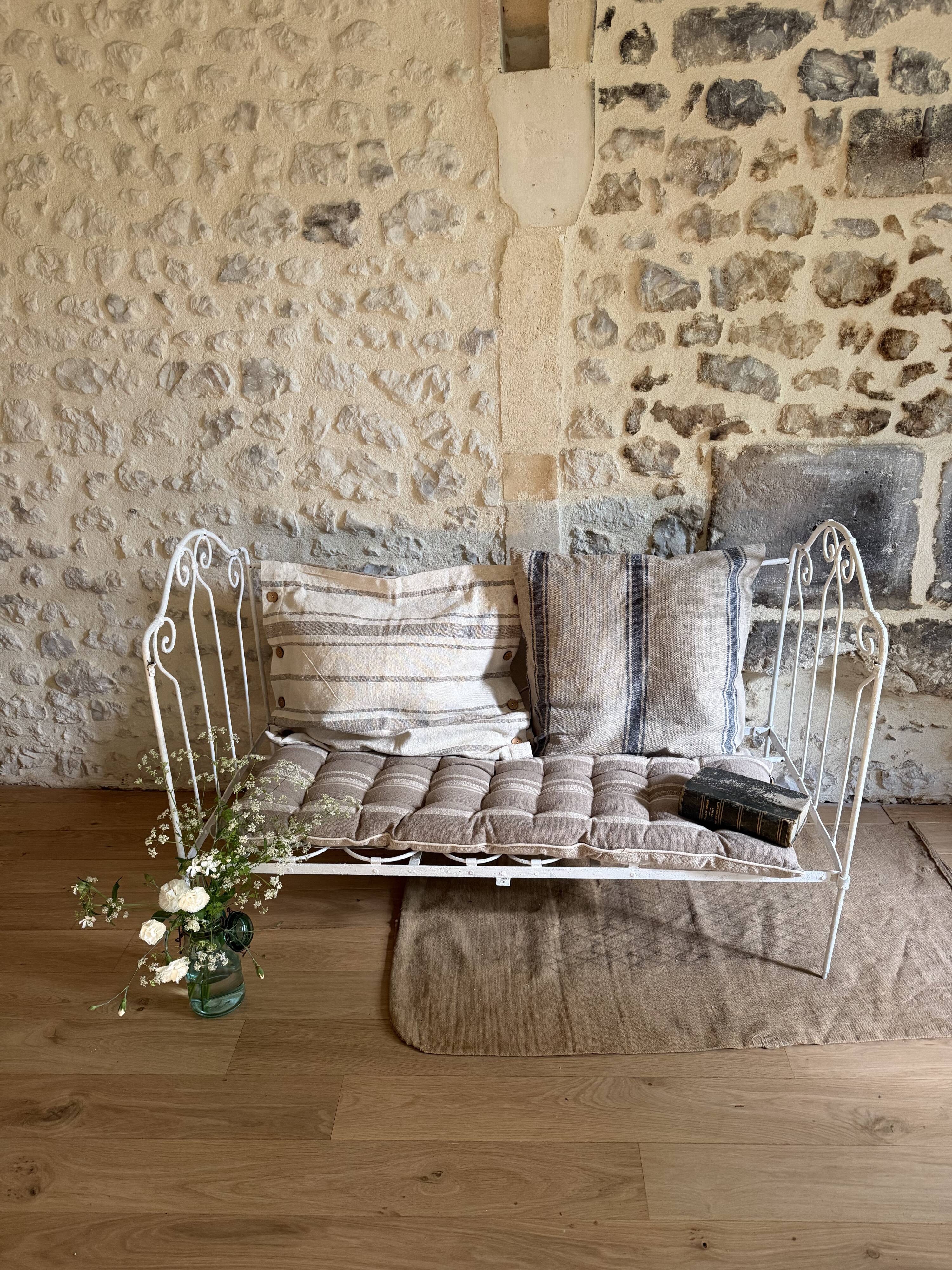 Small renovated wrought iron bed