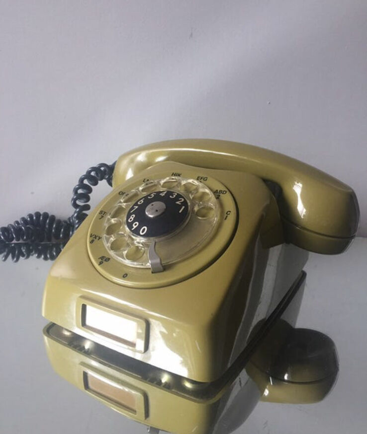 Vintage mustard green rotary telephone