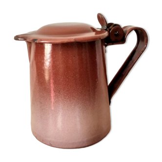 Old pitcher in brown enamelled sheet metal, spout and lid