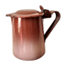 Old pitcher in brown enamelled sheet metal, spout and lid