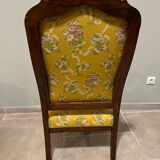 Louis XV style cabriolet armchair in solid wood, yellow floral fabric.