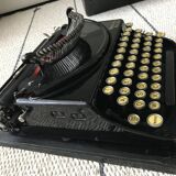 Machine à écrire remington portable en état de marche