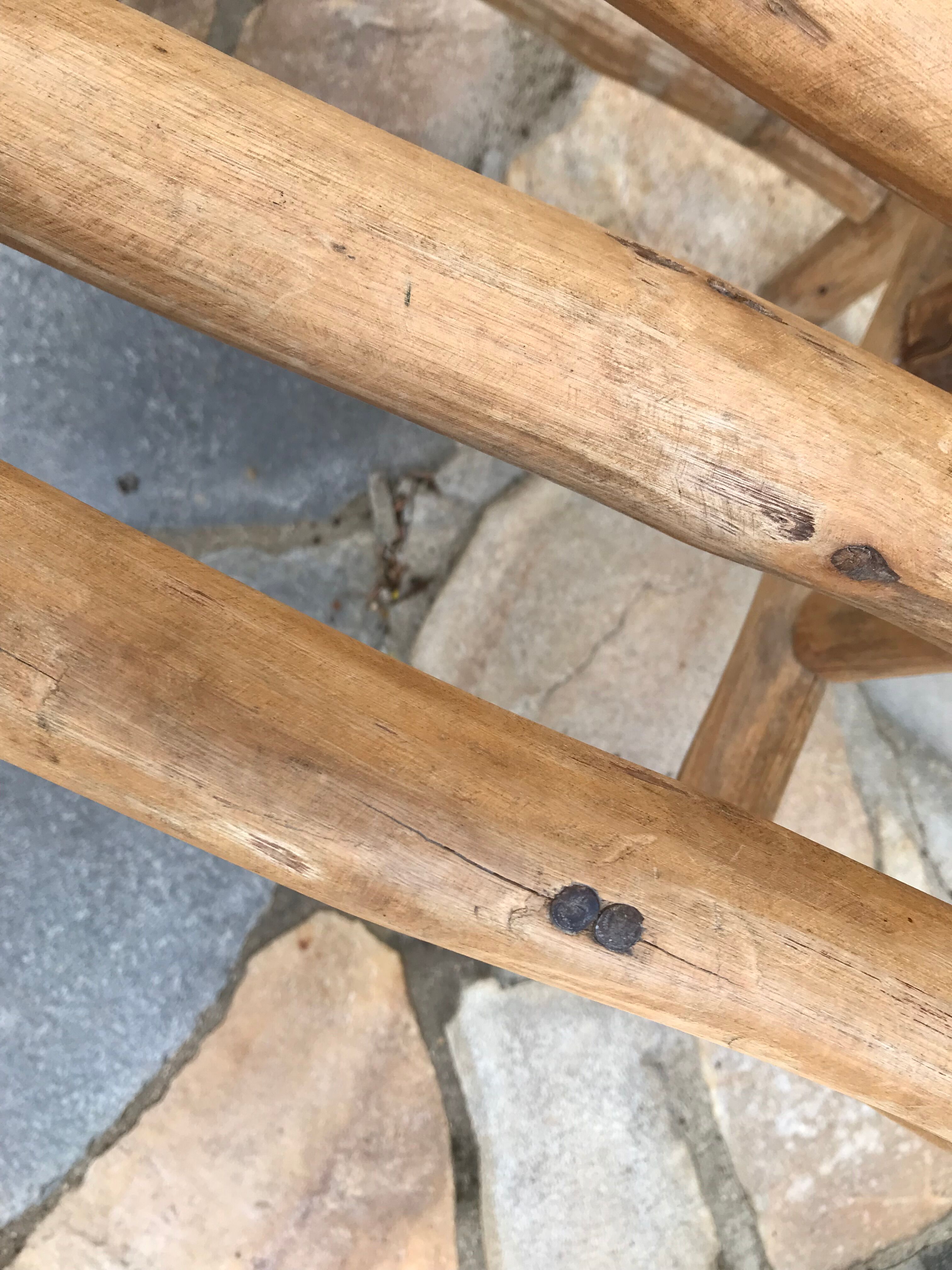 Art-Populaire armchair in raw wood, circa 1950.