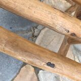 Art-Populaire armchair in raw wood, circa 1950.