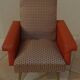 Retro vintage rockabilly armchair in orange faux leather and vintage fabrics
