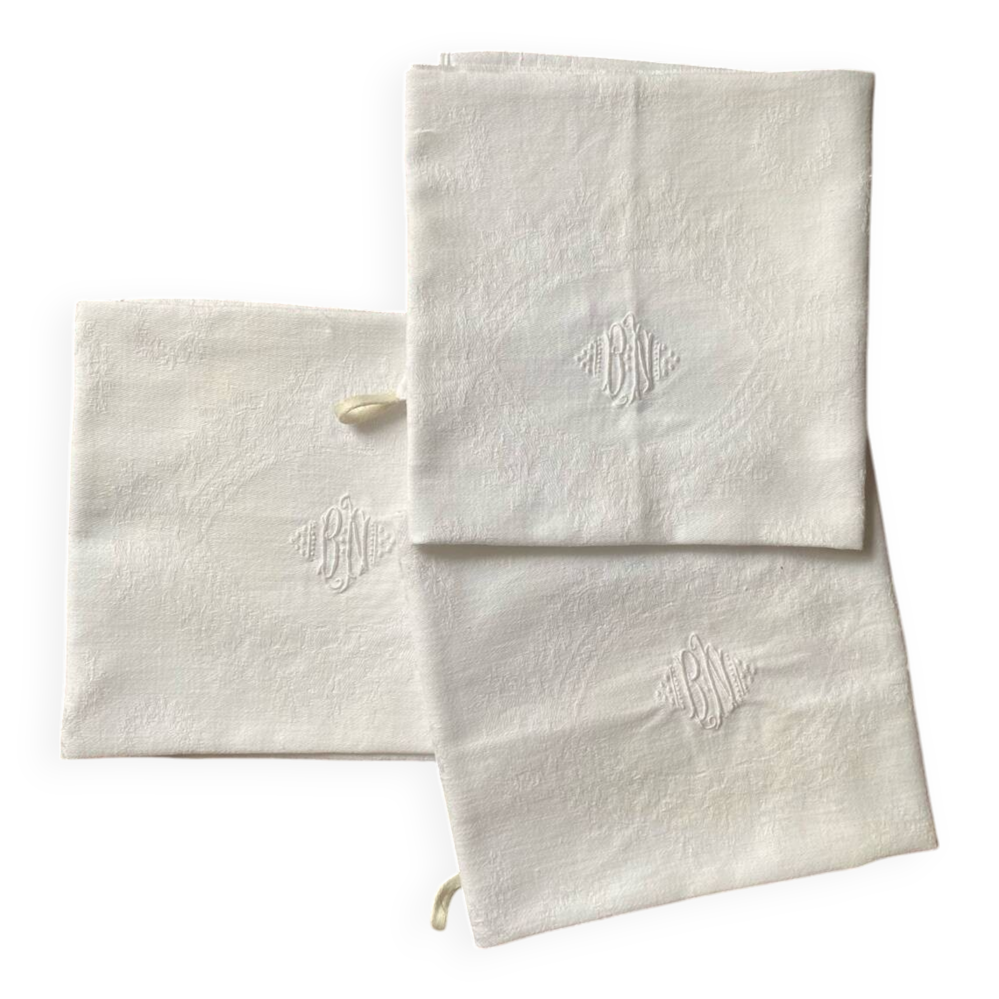 3 white tea towels in damask cotton thread with BN monogram.
