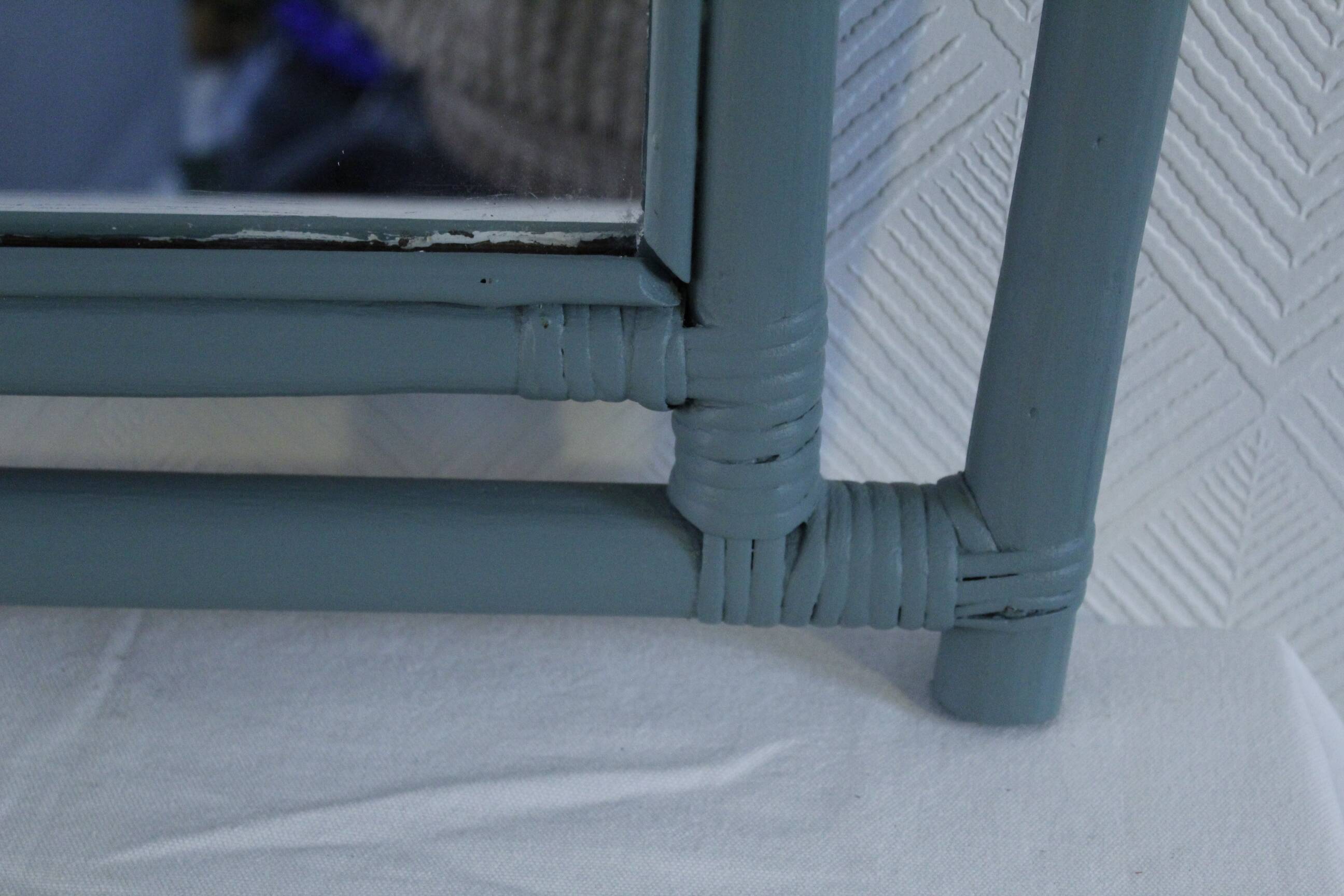 Sage green painted rattan mirror