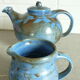 Vernified and flamed sandstone teapot, and its milk pot