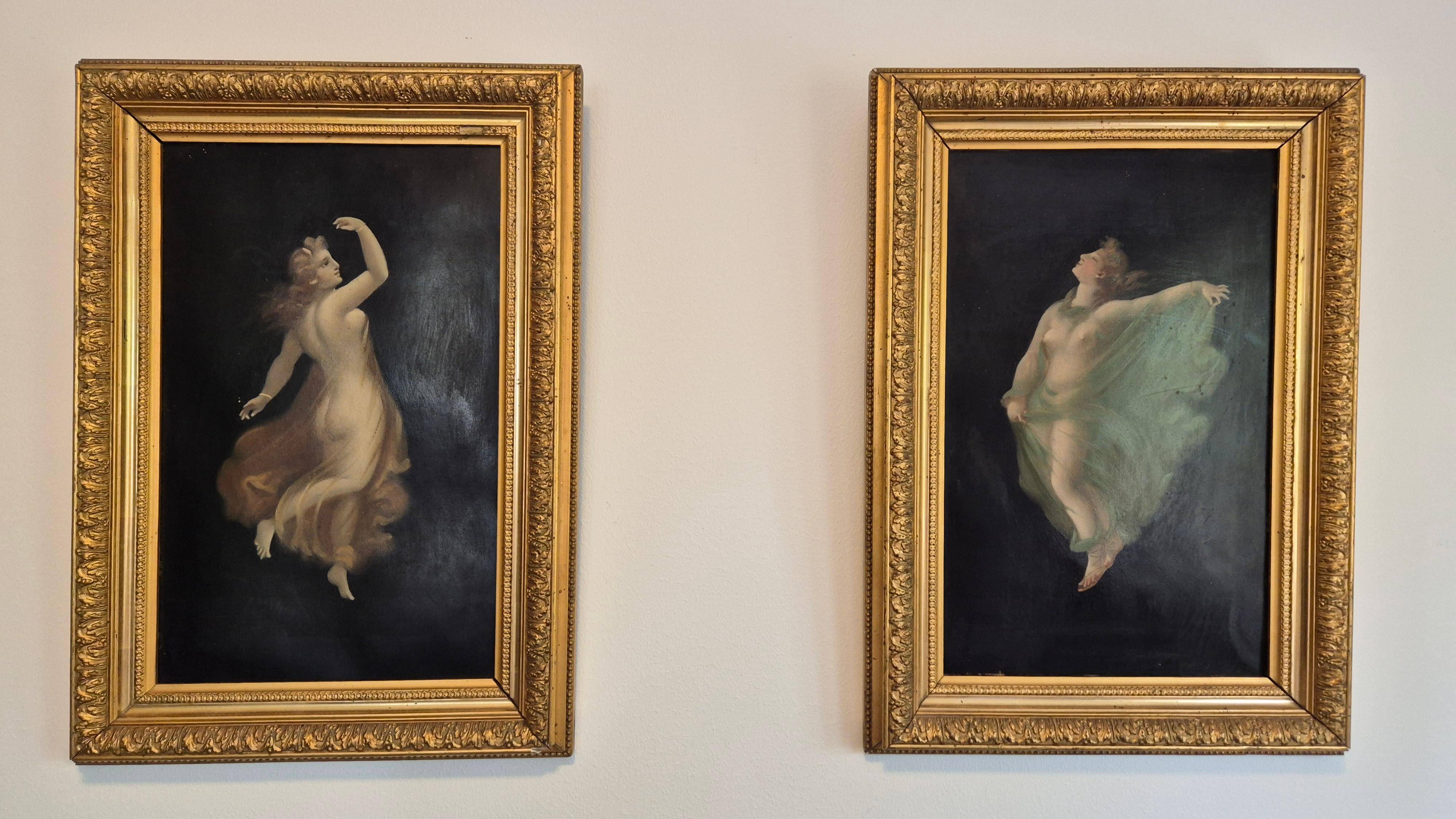 Pair of oil paintings in the neoclassical style depicting dancing nymphs dressed in transparent gowns, dating from the mid-19th century.