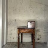 Wooden lady's desk says "happiness of the day"