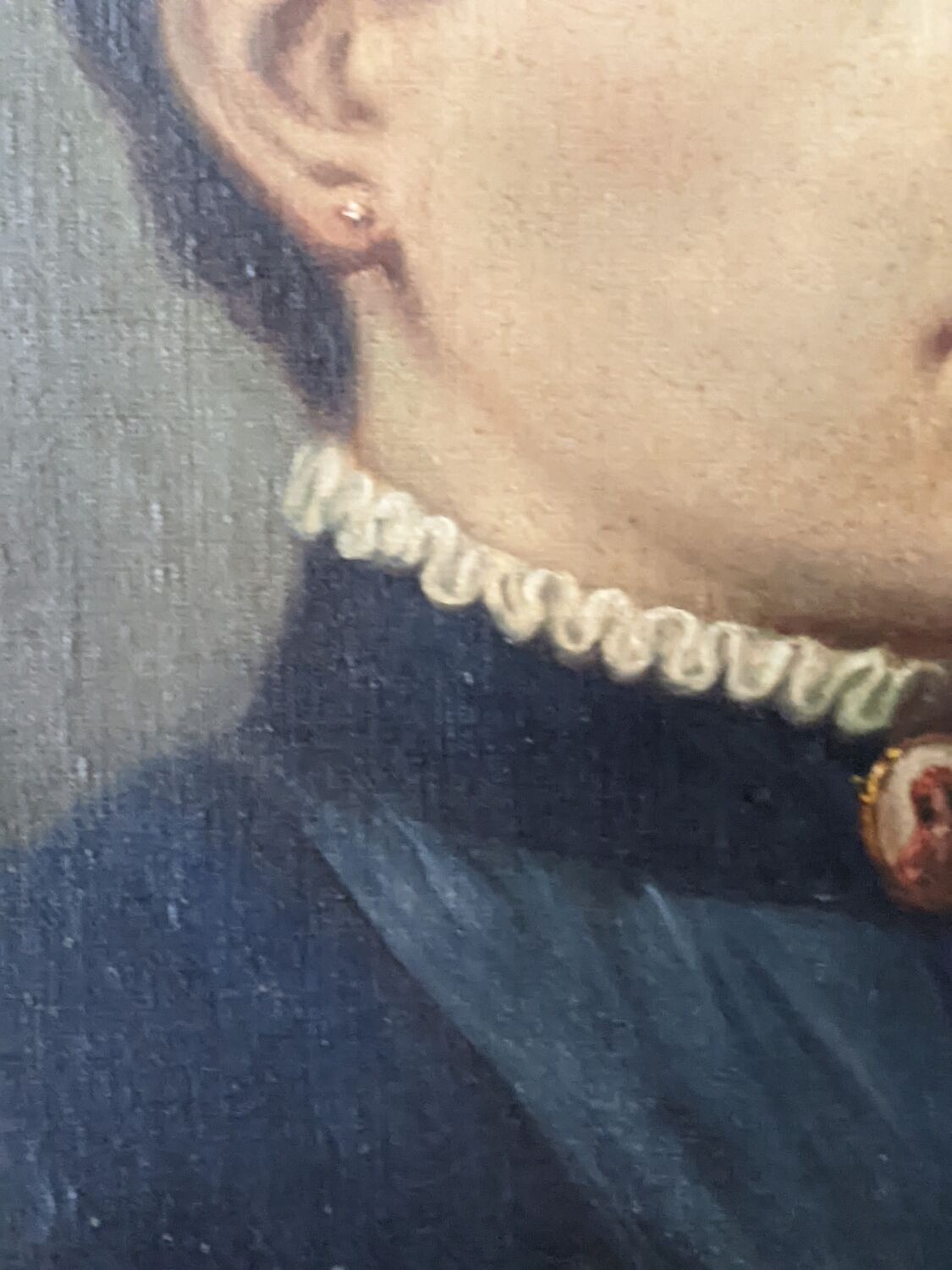 Oil on canvas portrait in an antique gilded wooden frame.