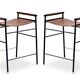 Pair of backless bar stools in brown and black metal.