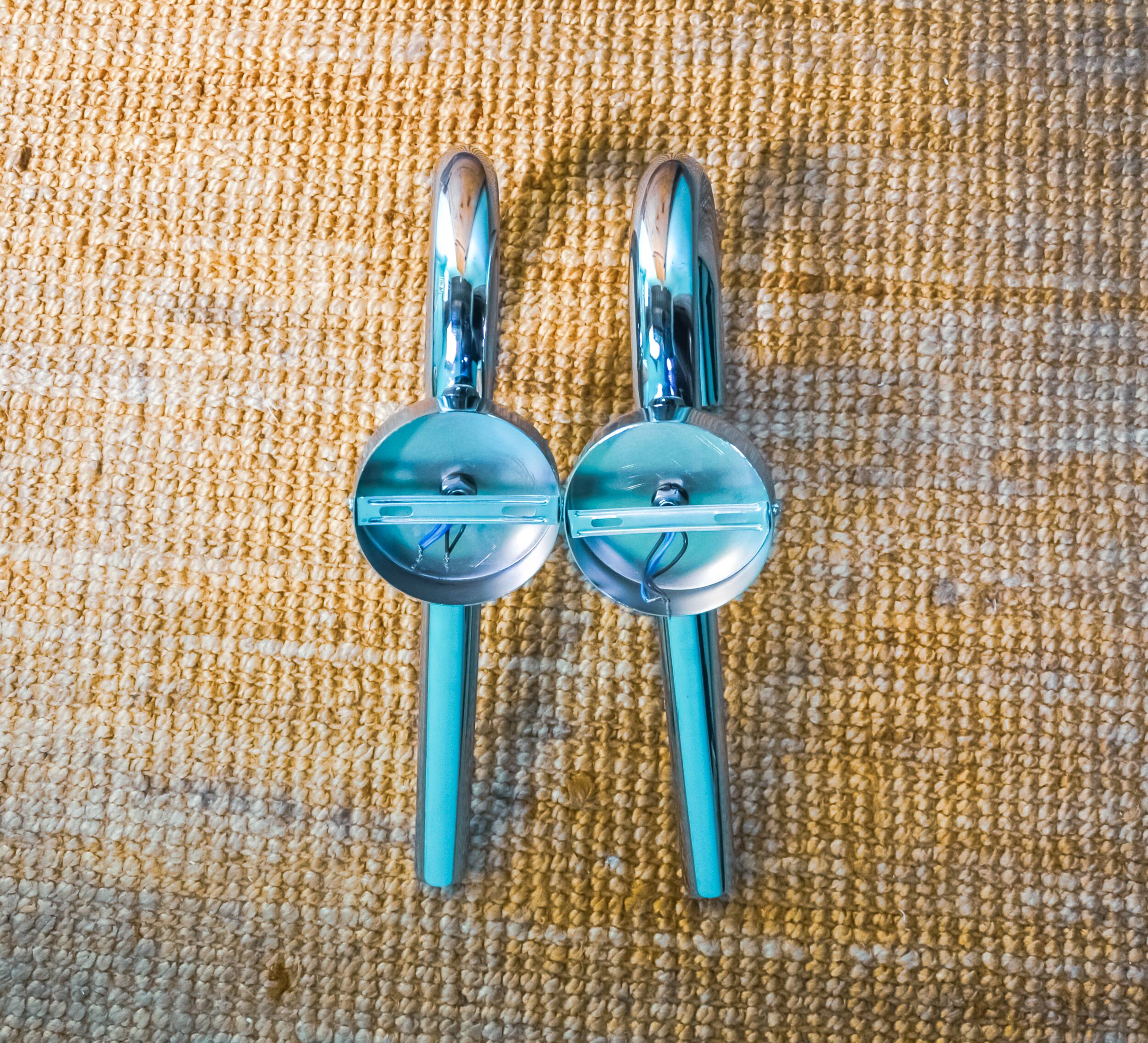 Pair of space-age tubular wall lights, chromed metal, Italy, 1970