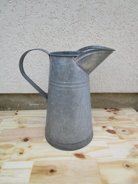 Old zinc garden broc