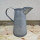 Old zinc garden broc