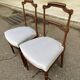 2 Louis XVI period chairs in solid wood and grey fabric.